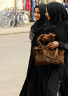 Eritrea - Asmara: black clad Muslim girls walking in the street - photo by E.Petitalot