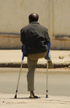 Eritrea - Asmara: handicapped man - war amputation - photo by E.Petitalot