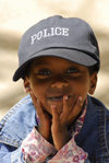 Eritrea - Asmara: smilling boy with a police cap - photo by E.Petitalot