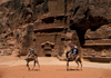 Jordan - Petra: tourists on camels - photo by J.Wreford