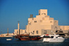 Doha, Qatar: dhow and yacht near the Museum of Islamic Art - IM Pei decided to build the museum on the water - photo by M.Torres