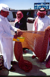 Saudi Arabia - Asir province Abha: textiles at the market - photo by F.Rigaud