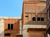 Jeddah, Mecca Region, Saudi Arabia: Suq Al Alawi - derelict hedjazi architecture in Al Balad district - arabian closed balconies and terrace annexes, Historic Jeddah, the Gate to Makkah, UNESCO world heritage site - photo by M.Torres