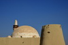 Al-Hofuf, Al-Ahsa Oasis, Eastern Province, Saudi Arabia: dome of the Qubbah Mosque / Ali Pasha mosque and the southwest tower of Ibrahim Castle - UNESCO world heritage site - photo by M.Torres