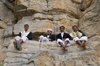 Kohlan / Quhlan, Qohlan, Hajjah governorate, Yemen: local men gathered on rocks - cliff face - photo by J.Pemberton